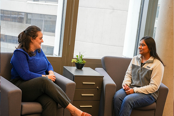 Graduate students having a conversation