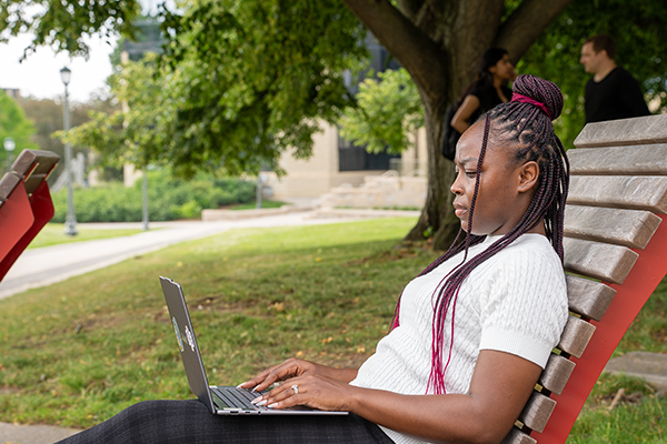 Student using a laptop on campus
